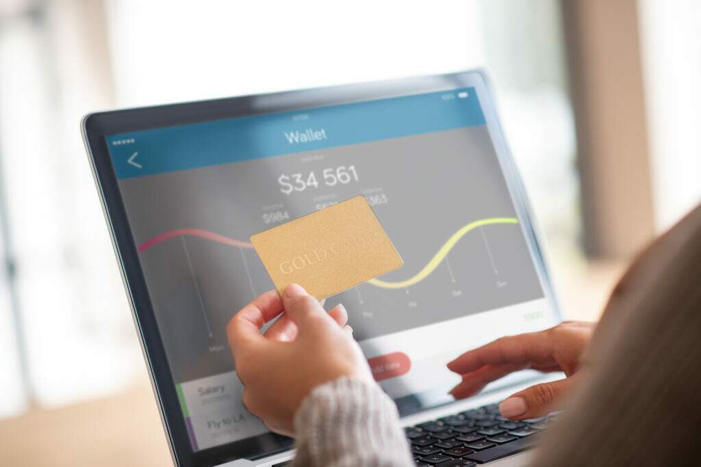 Close Up Of Woman Checking Balance Of Bank Account Online - S&F Assessoria Contábil